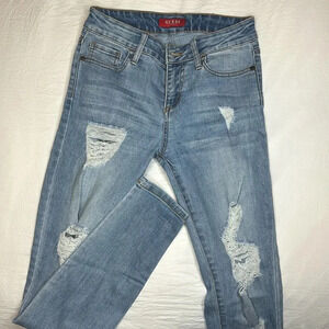 Distressed Guess skinny jeans